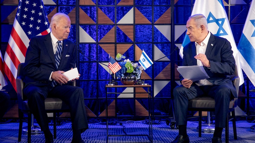 Two mean speak on seats. Biden with an american flag behing him and netanyahu with israel flag behind