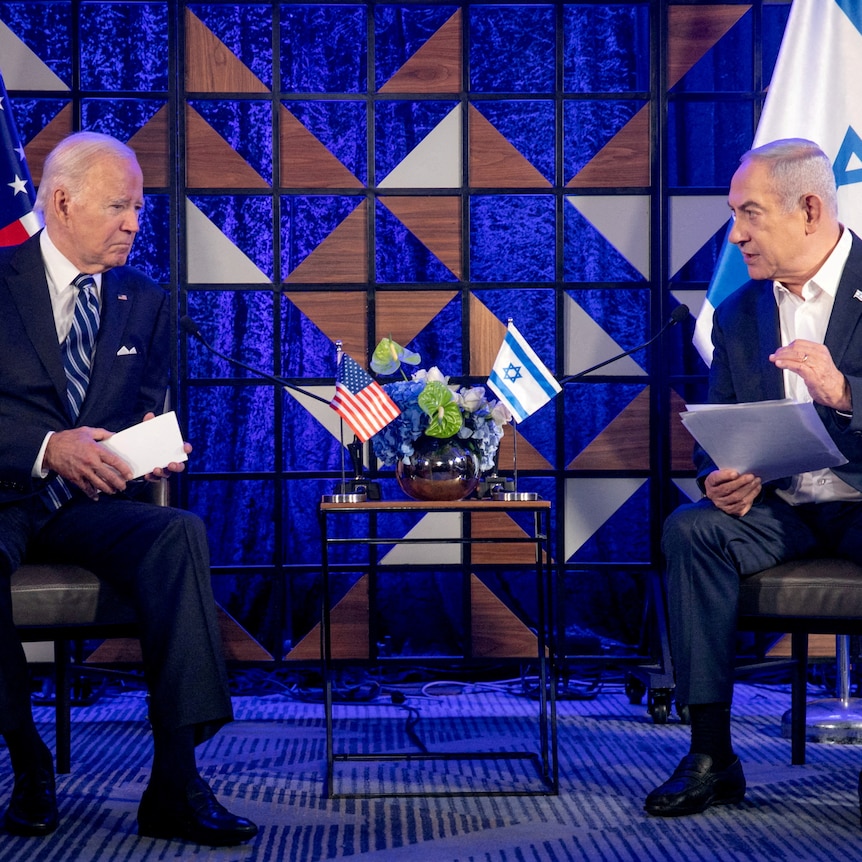 Two mean speak on seats. Biden with an american flag behing him and netanyahu with israel flag behind