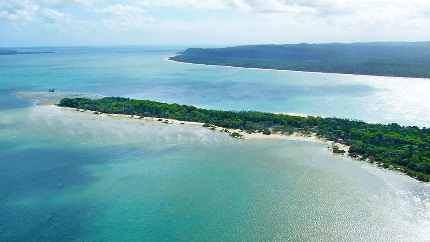 Aerial photo of island with sandy beach