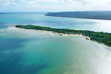 Aerial photo of island with sandy beach