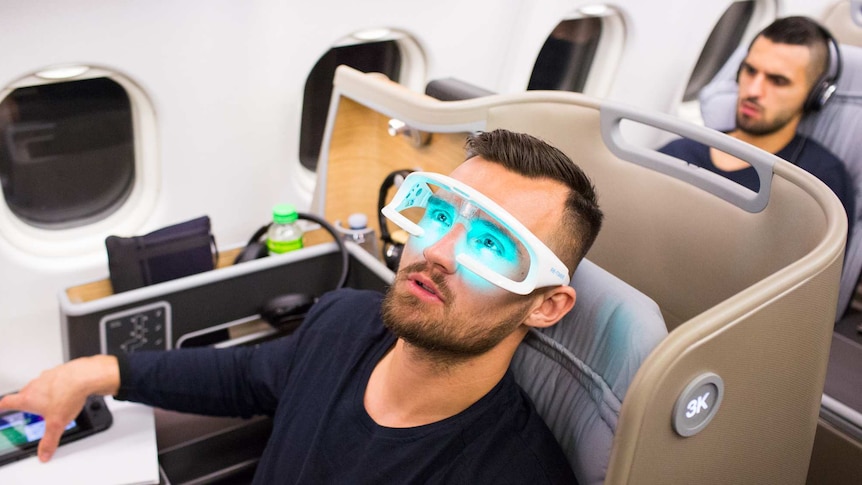 Bailey Wright wearing anti-fatigue glasses on Socceroos charter flight