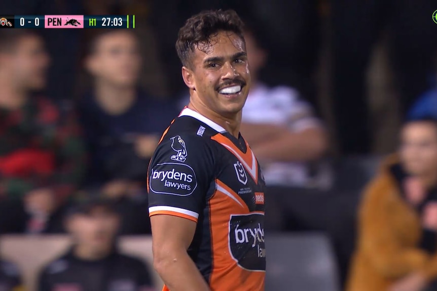 Wests Tigers fullback Daine Laurie smiles after getting a penalty for a high tackle in the NRL game against Penrith Panthers.