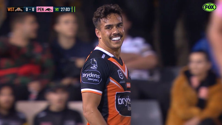 Wests Tigers fullback Daine Laurie smiles after getting a penalty for a high tackle in the NRL game against Penrith Panthers.