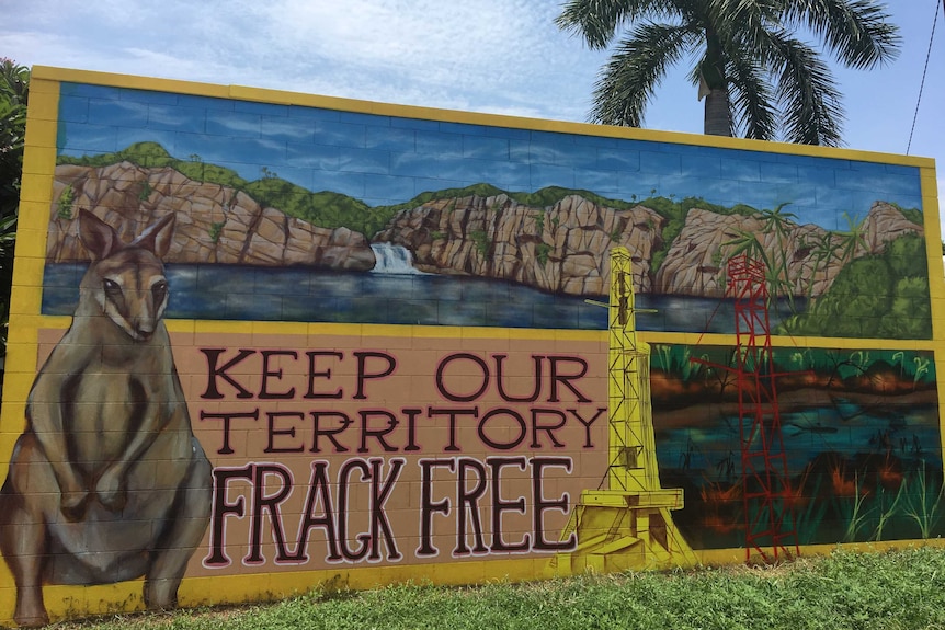 A mural showing the Katherine landscape saying Keep Our Territory Frack Free.