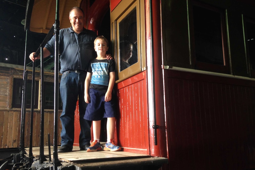 Andrew Gordon and his son William work on restoring carriages together.