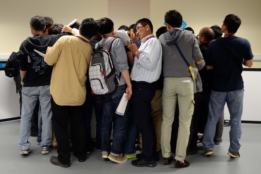 A crowd of journalists