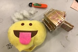 Yellow fluffy toy alongside illegal tobacco
