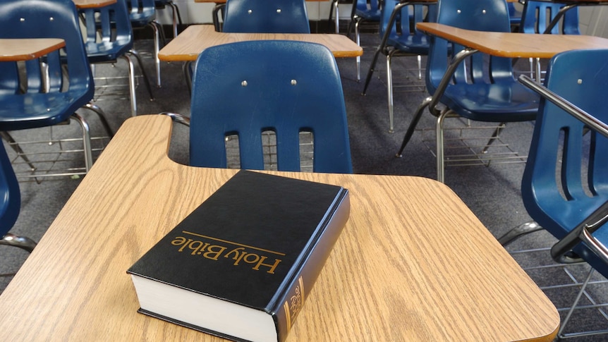 A Bible on a school desk