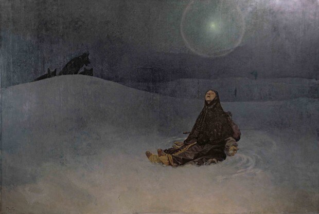 Woman sitting in the snow looking into the misty sky