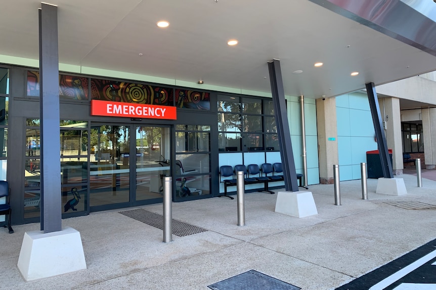 A red 'emergency' sign sits above the door at Redcliffe Hospital