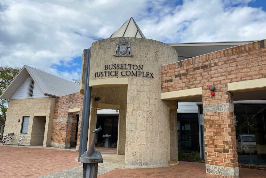 A sandstone and brick building with Busselton Justice Complex sign.