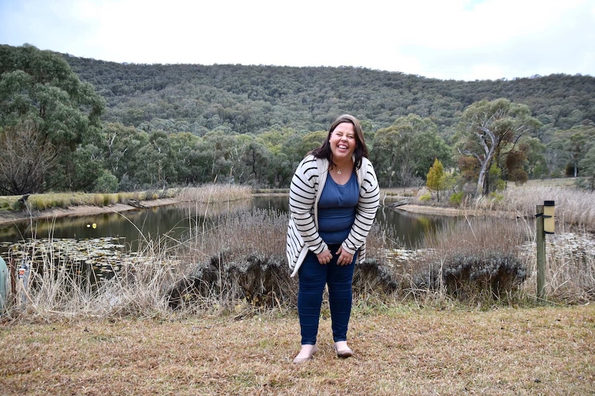 Portrait of Sarahjane Bradford who overcame experiences of domestic violence and is grateful to her elected parents for support.