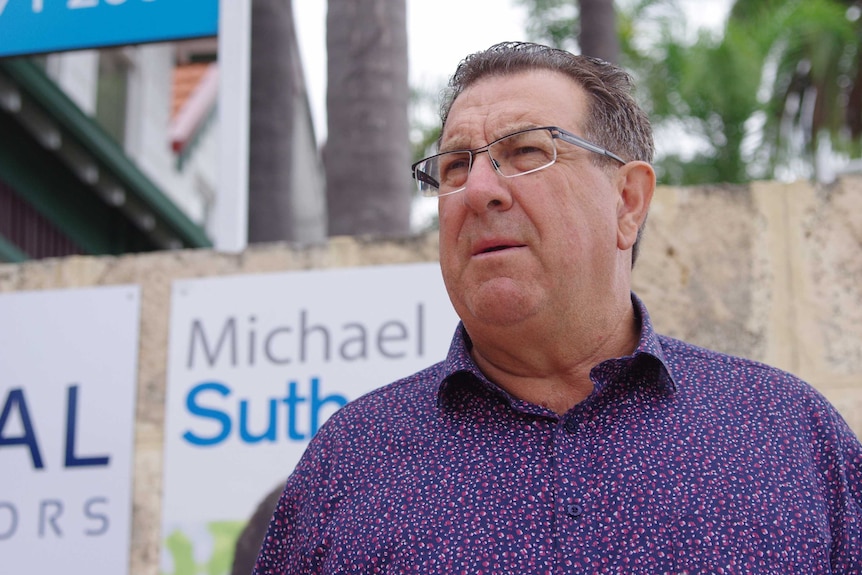 Head and shoulders shot of Michael Sutherland standing outside