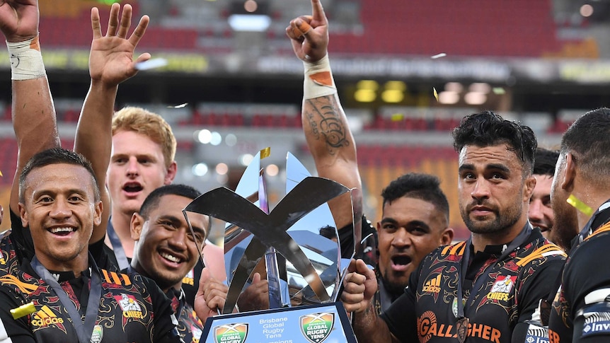 Chiefs captain Liam Messam (right) and players celebrate following the final match of the Global Rugby Tens between the Canterbury Crusaders and the Waikato Chiefs at Suncorp Stadium in Brisbane