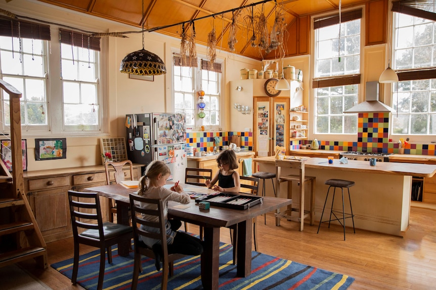 The kitchen and living room in a home.