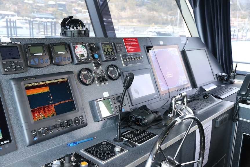 The interior of a large boat showing navigational systems