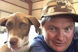 A selfie of a man and large dog side by side.