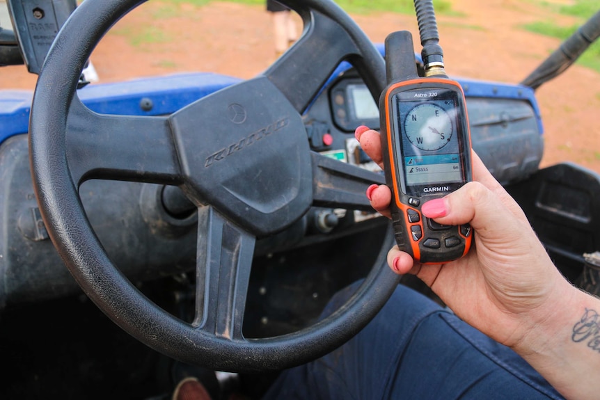 GPS tracker held in hand