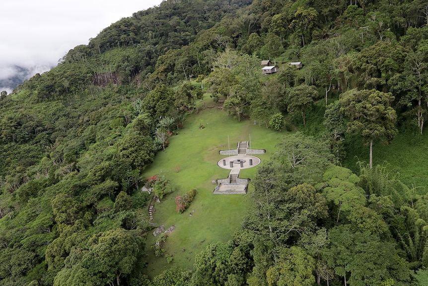 Aerial of the Isurava memorial surrounded by dense jungle on the Kokoda Track.