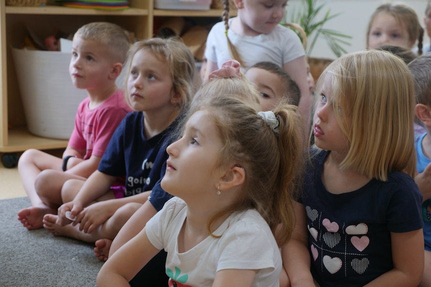 Young boys and girls faces, in a child care centre.