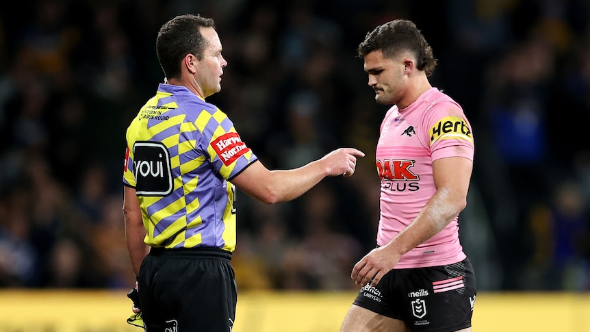 Nathan Cleary walks past a touch judge after being sent off.