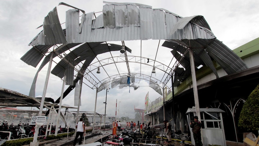 A destroyed awning outside a supermarket in Thailand after a car bomb.