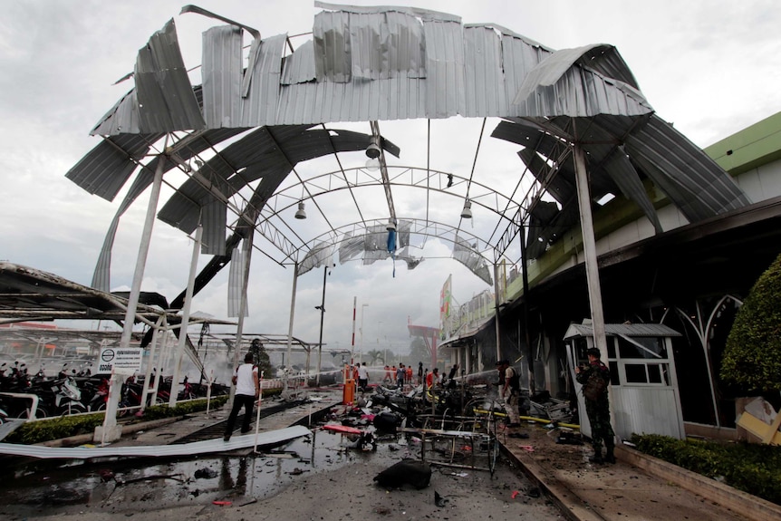 A destroyed awning outside a supermarket in Thailand after a car bomb.