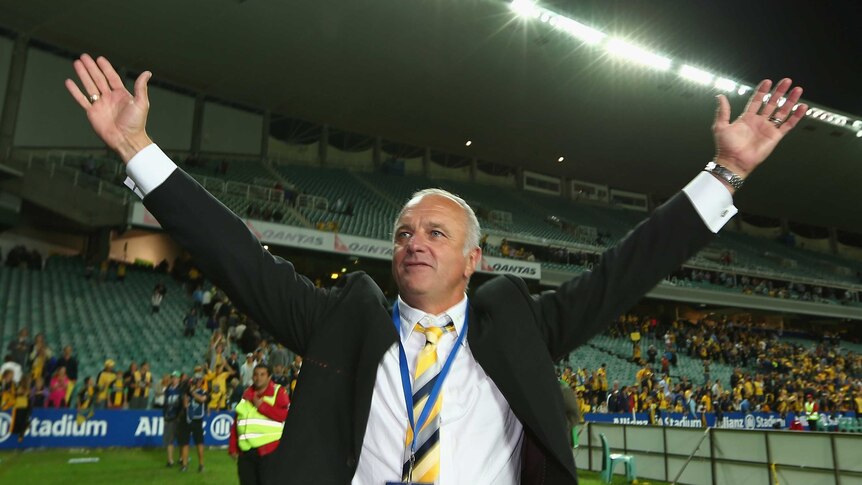 Then Mariners coach Graham Arnold celebrates winning the A-League in 2013.