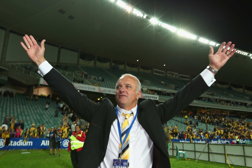 Mariners coach Graham Arnold celebrates winning the A-League.