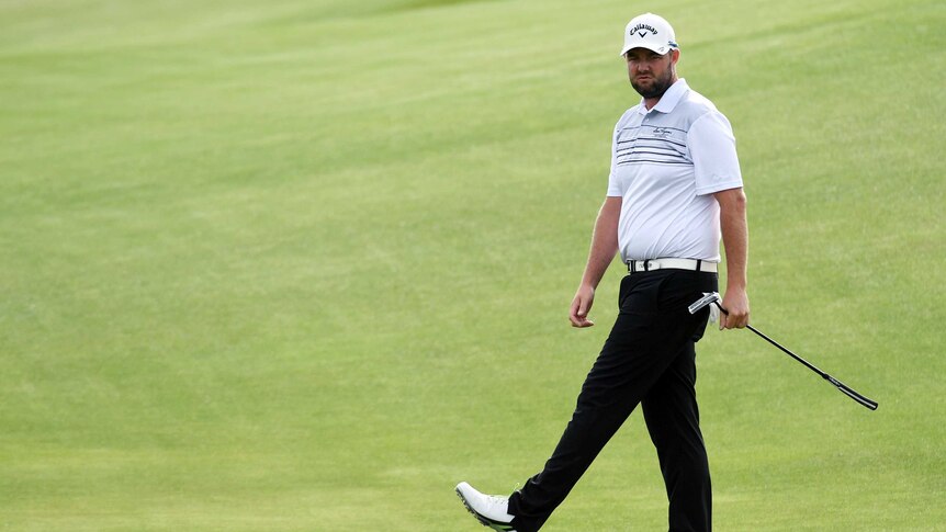 Marc Leishman watches a putt at the US Open