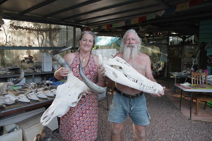 people in a demountable home with crocodile heads
