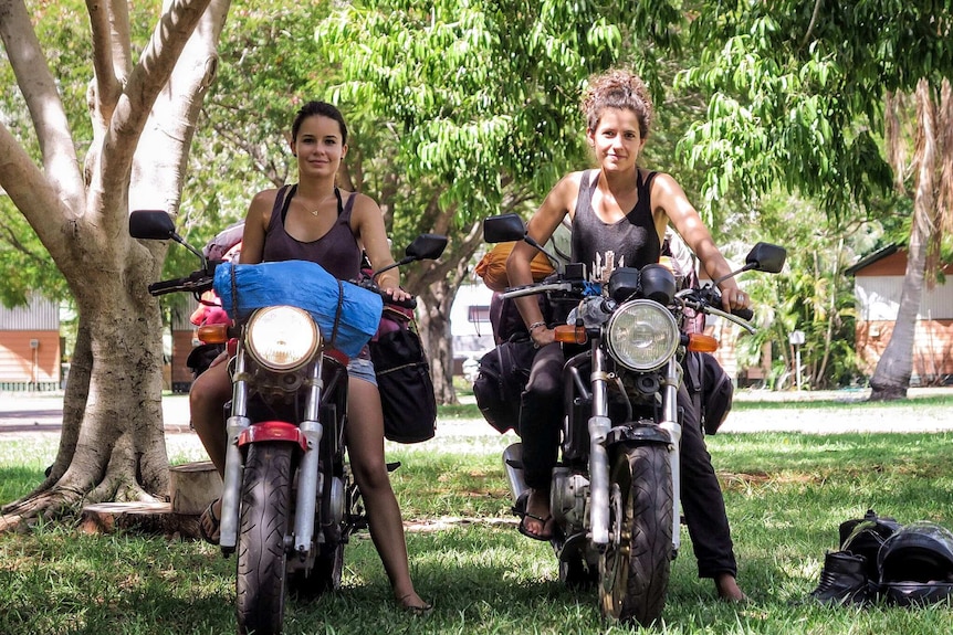 Laura Morin (left) and Audrey Lurbe on their motorcycles in Kununurra.