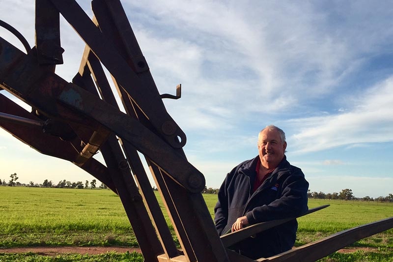 Farmer Darryl Halliwell by his oat crop during one of the wettest starts to the wet season in Condobolin.
