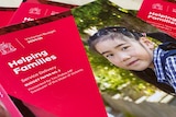 red brochure with school girl on the front