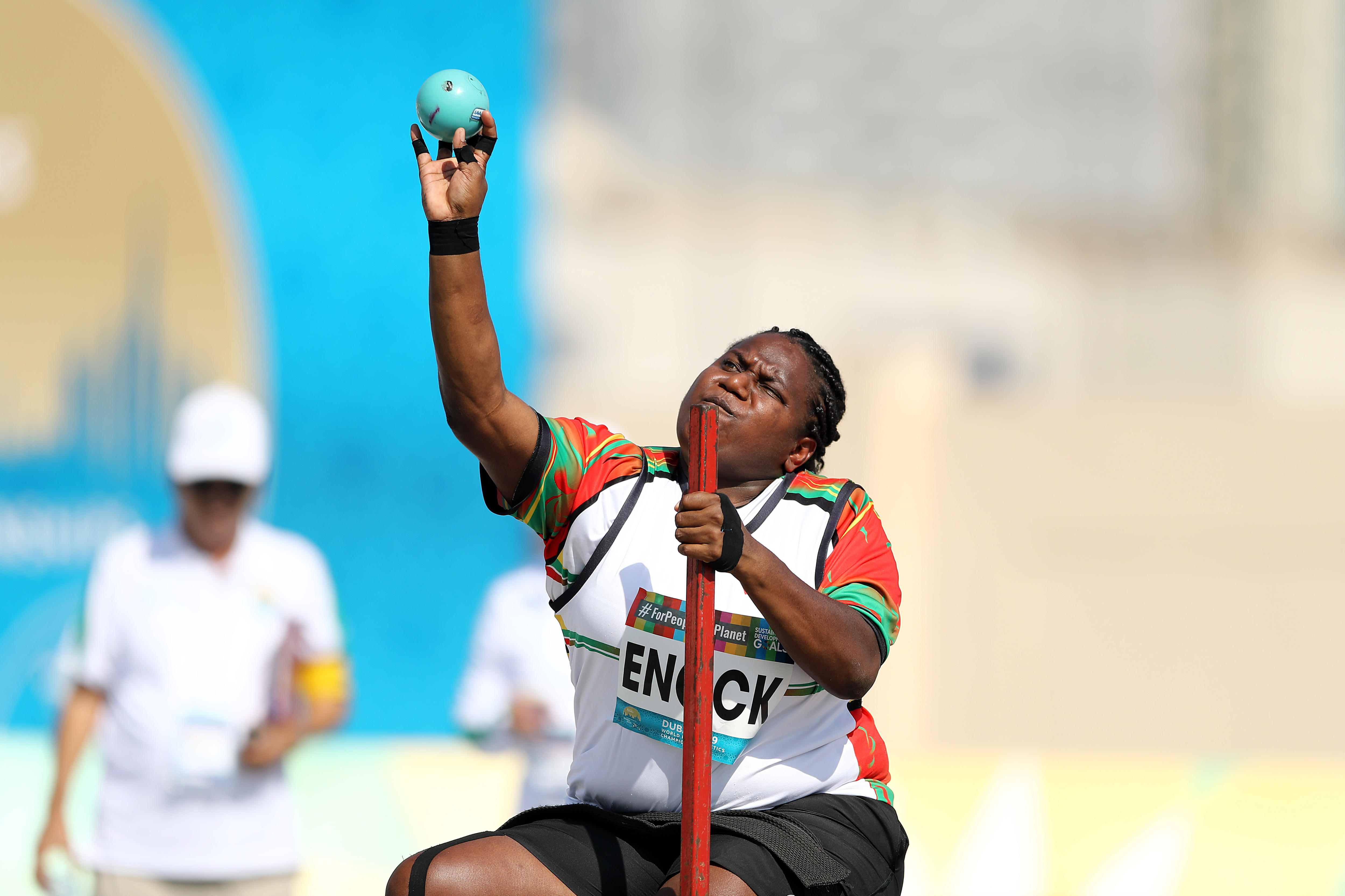 Elie Enock throws a shot put