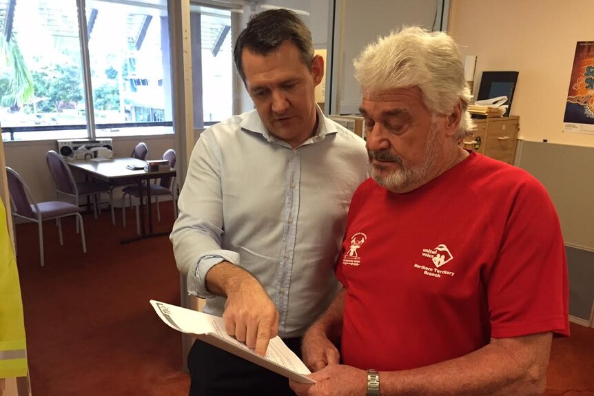 Jock McLeod shows his rejection letter to Labor leader Michael Gunner