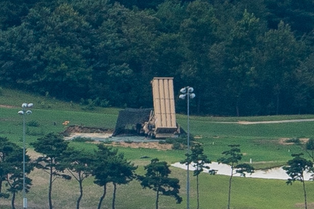 Close-up shot of THAAD sitting on a green golf course.
