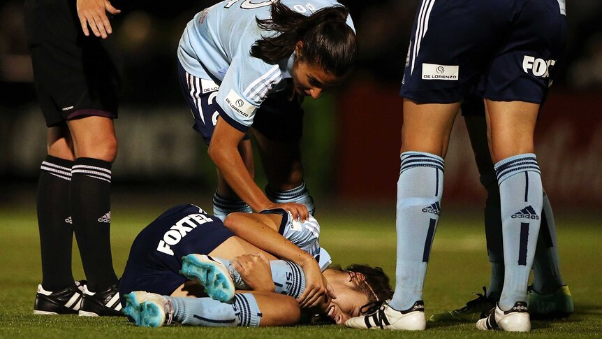Sydney FC's Amy Harrison lies on the ground