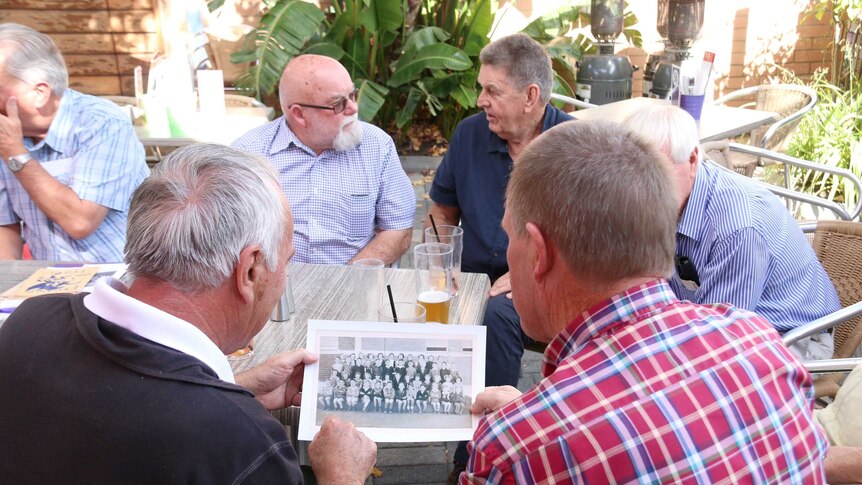 A group of childhood friends reconvene at a Perth pub after connecting through Facebook.