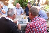 A group of childhood friends reconvene at a Perth pub after connecting through Facebook.