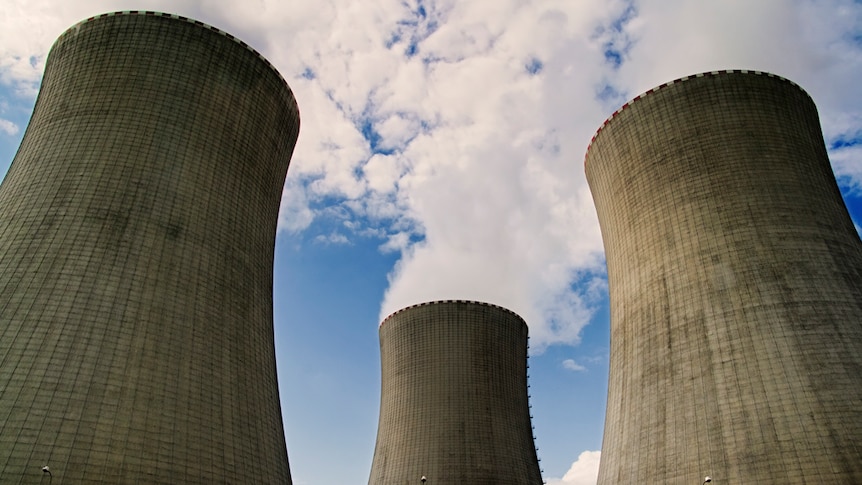 Steam rises from the stacks of a nuclear power plant