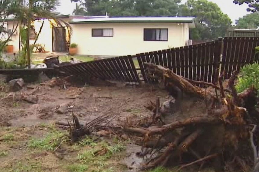 Damaged fence and tree down at house in Cooktown after Cyclone Nathan