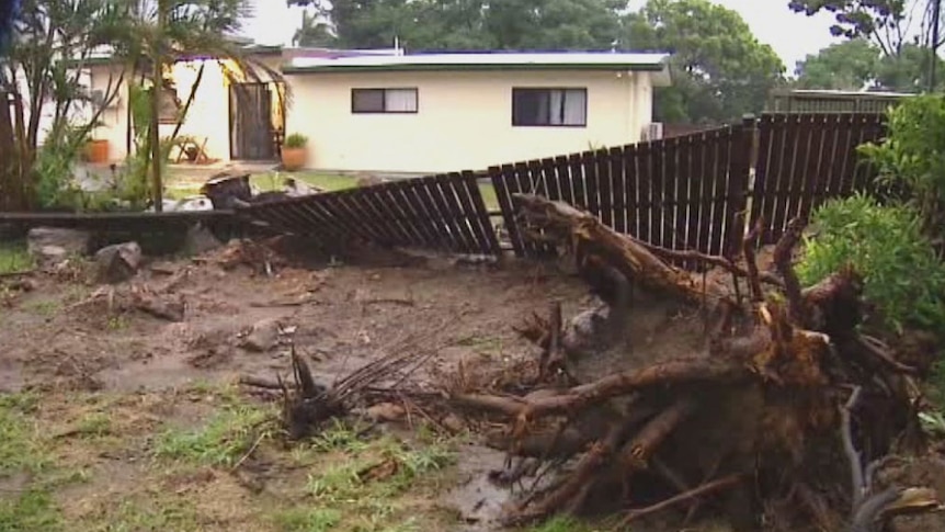 Damaged fence and tree down at house in Cooktown after Cyclone Nathan