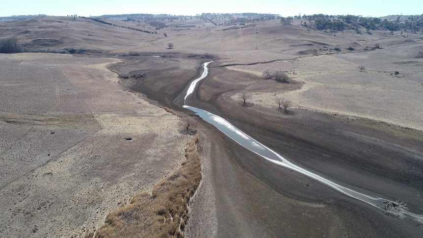 An aerial photo of Armidale's dry Malpas Dam.