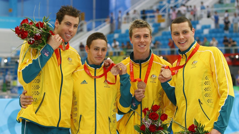 Grant Hackett, Nick Ffrost, Grant Brits, and Patrick Murphy pose with their bronze medals