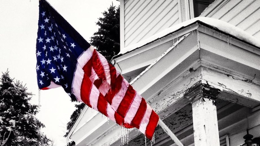 A frozen US flag on a porch in Augusta, Maine, January 2014