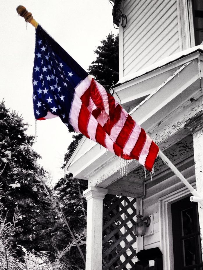 A frozen US flag on a porch in Augusta, Maine, January 2014