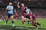 Valentine Holmes of the Queensland Maroons scores during State of Origin Game 3.
