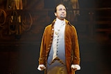 Lin-Manuel Miranda on stage in costume as Alexander Hamilton