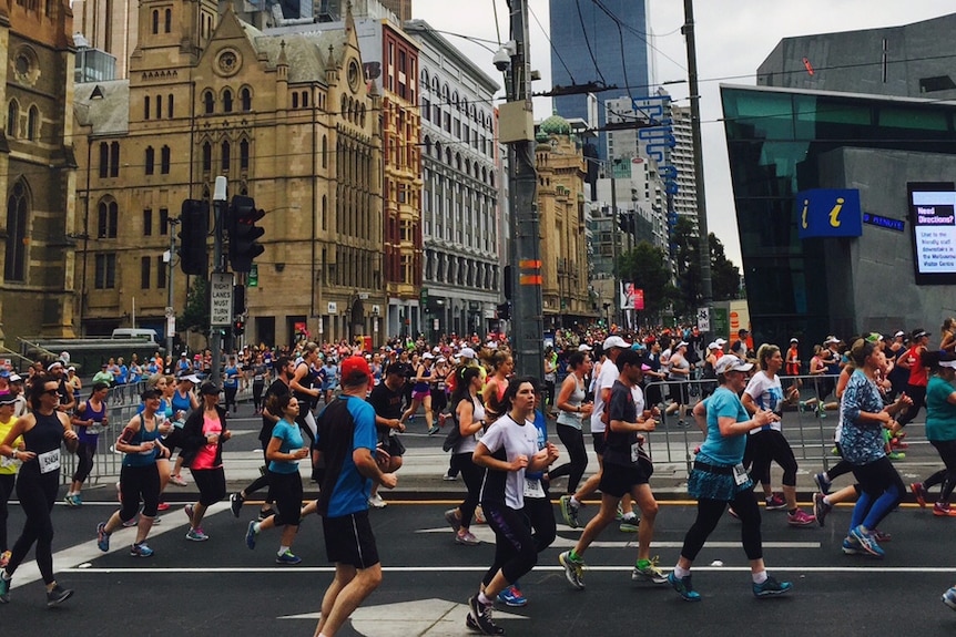 Melbourne marathon participants run past Federation Square on October 18, 2015.
